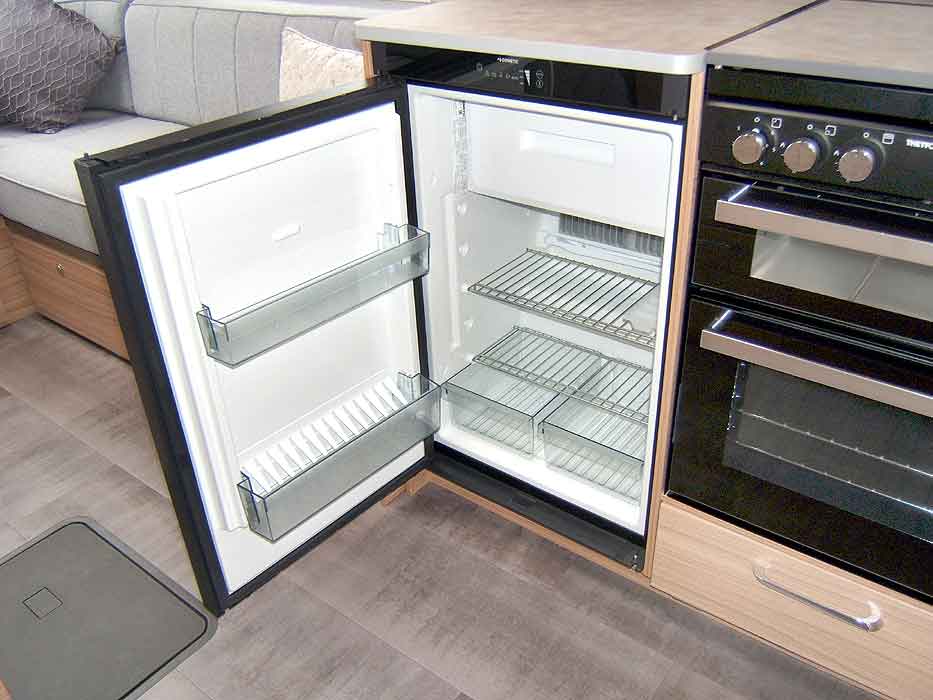 View of the fridge and freezer top box interior - in excellent condition.